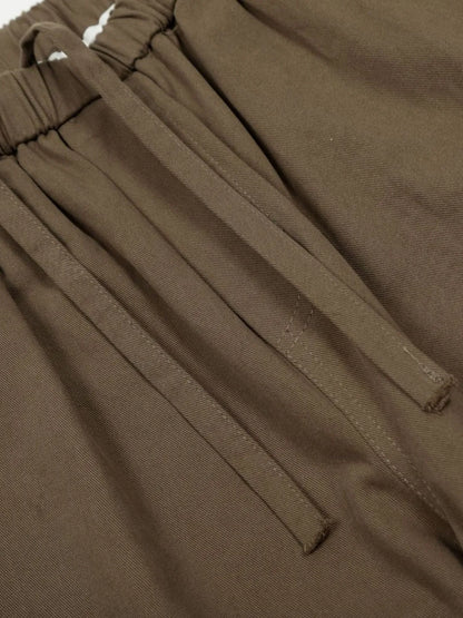 Olive brown men's wide-leg drawstring trousers — drawstring close-up