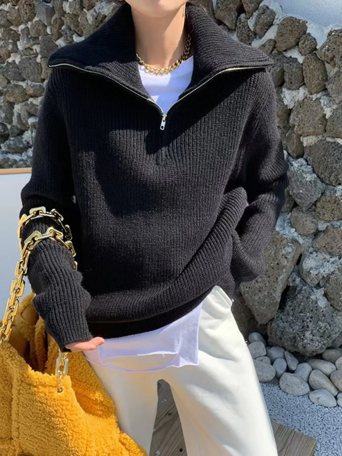 Half-zip long-sleeve ribbed sweater with a high collar.