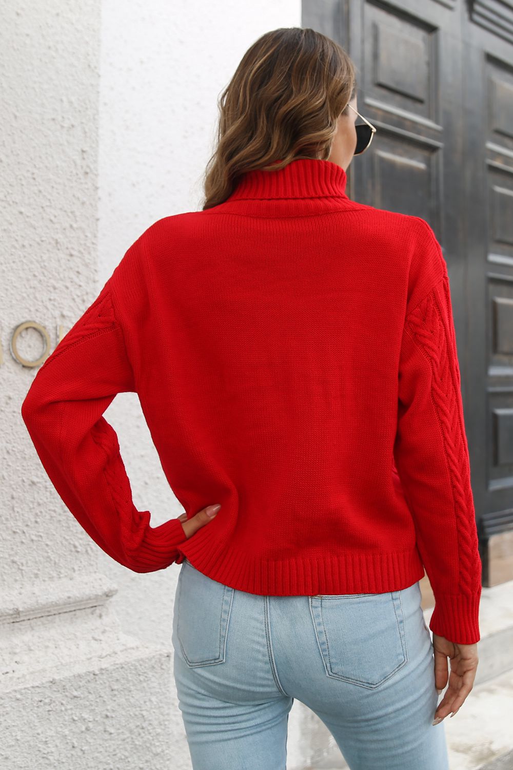Long-sleeve turtleneck sweater with a textured knit finish.