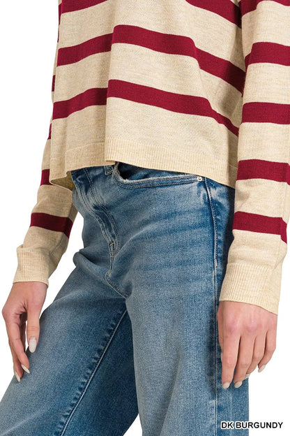 Close view of the sweater’s striped hem and ribbed sleeve cuff; jeans are not included.