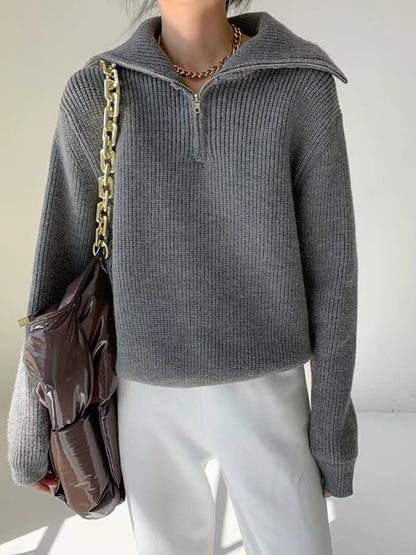 Half-zip long-sleeve ribbed sweater with a high collar.