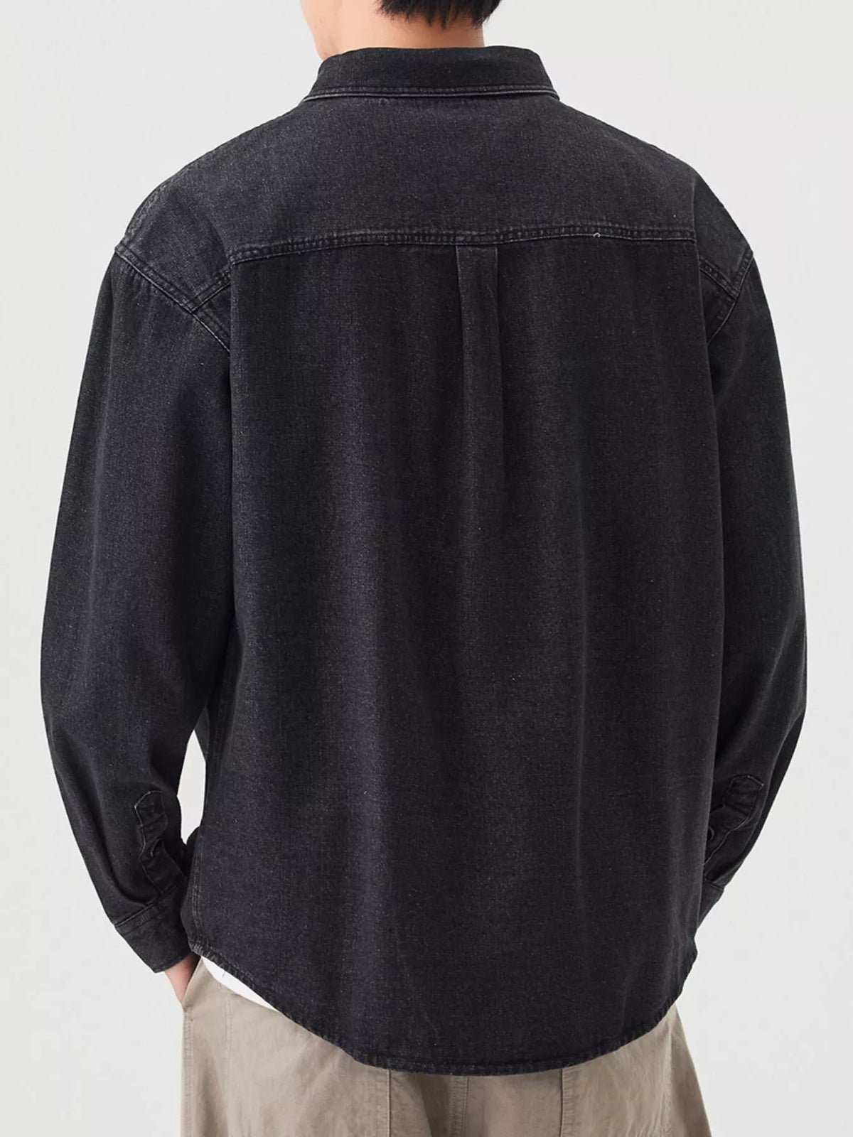 Black men's button-up denim shirt, back view