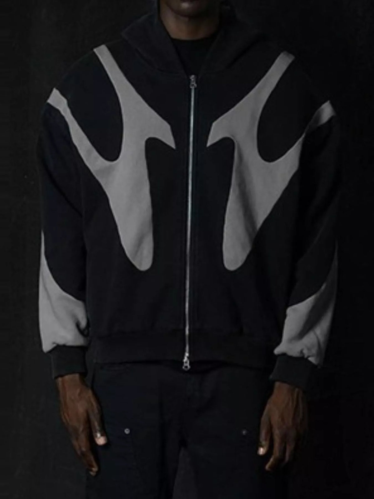 Black and gray oversized zip hoodie worn from the front