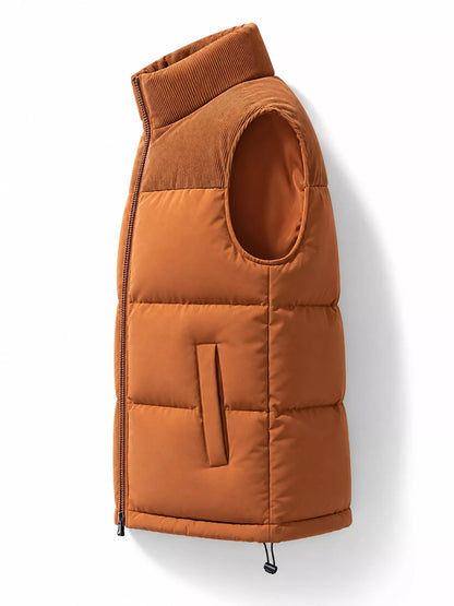 Caramel men's corduroy-panel puffer vest, side view. One vest is sold.