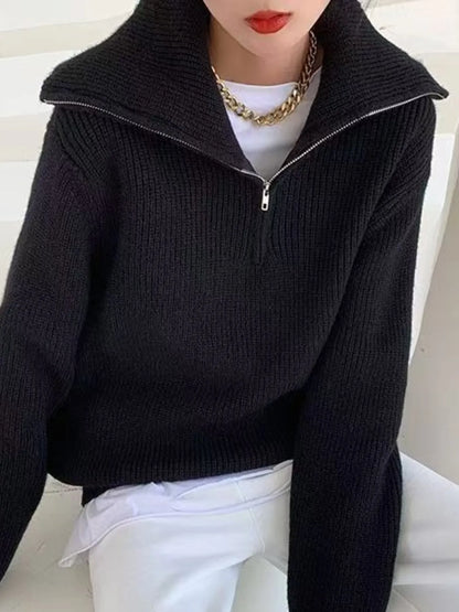 Half-zip long-sleeve ribbed sweater with a high collar.