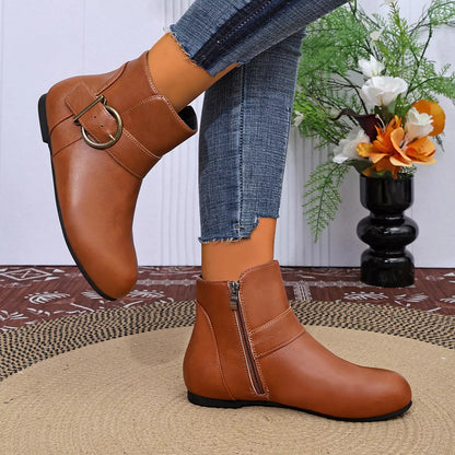 Brown ankle boots showing side profile and zipper