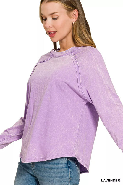 Three-quarter side view of the lavender Zenana cotton long-sleeve top with raw hem. Top only.