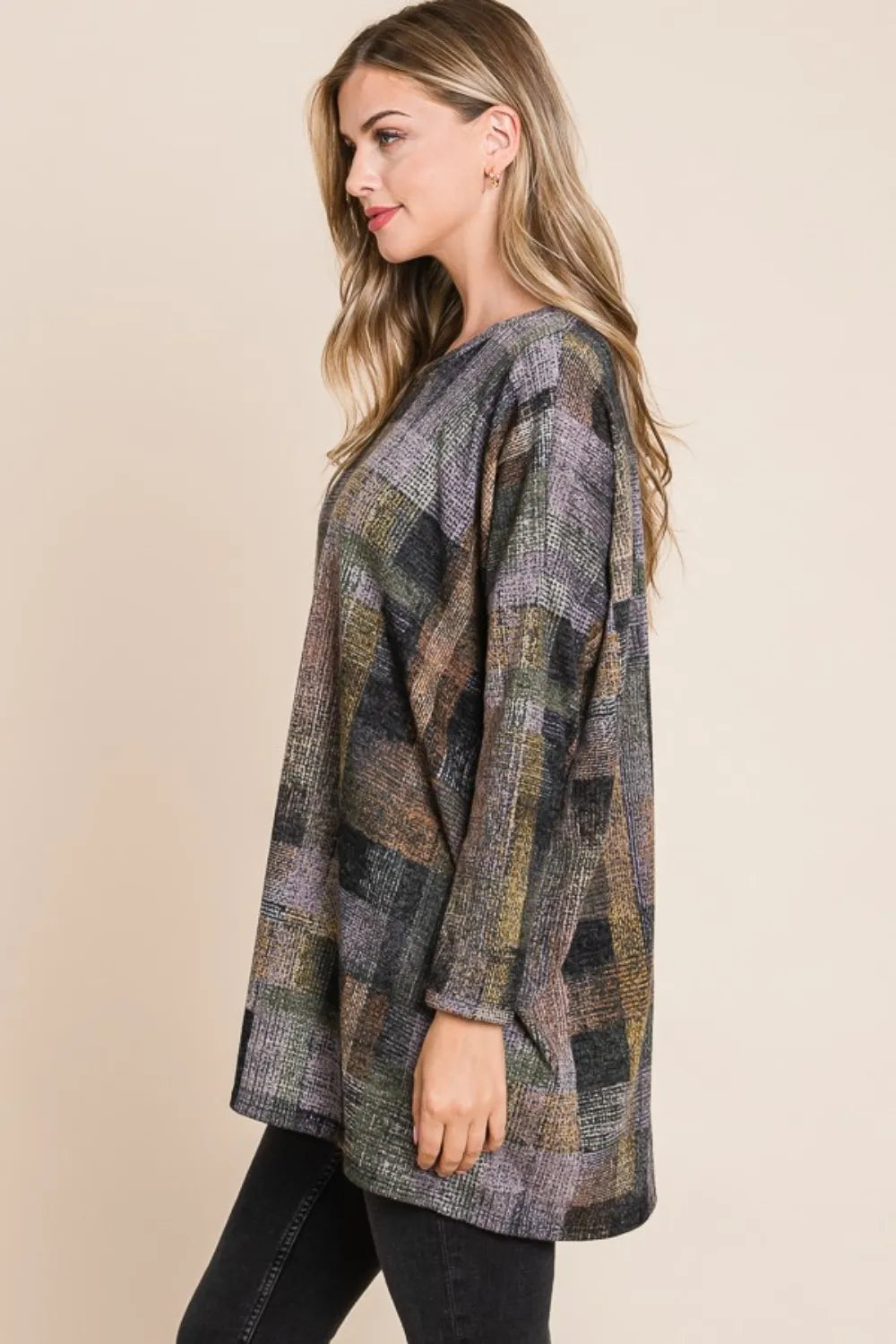 Side view of the BOMBOM plaid top showing its longer hem