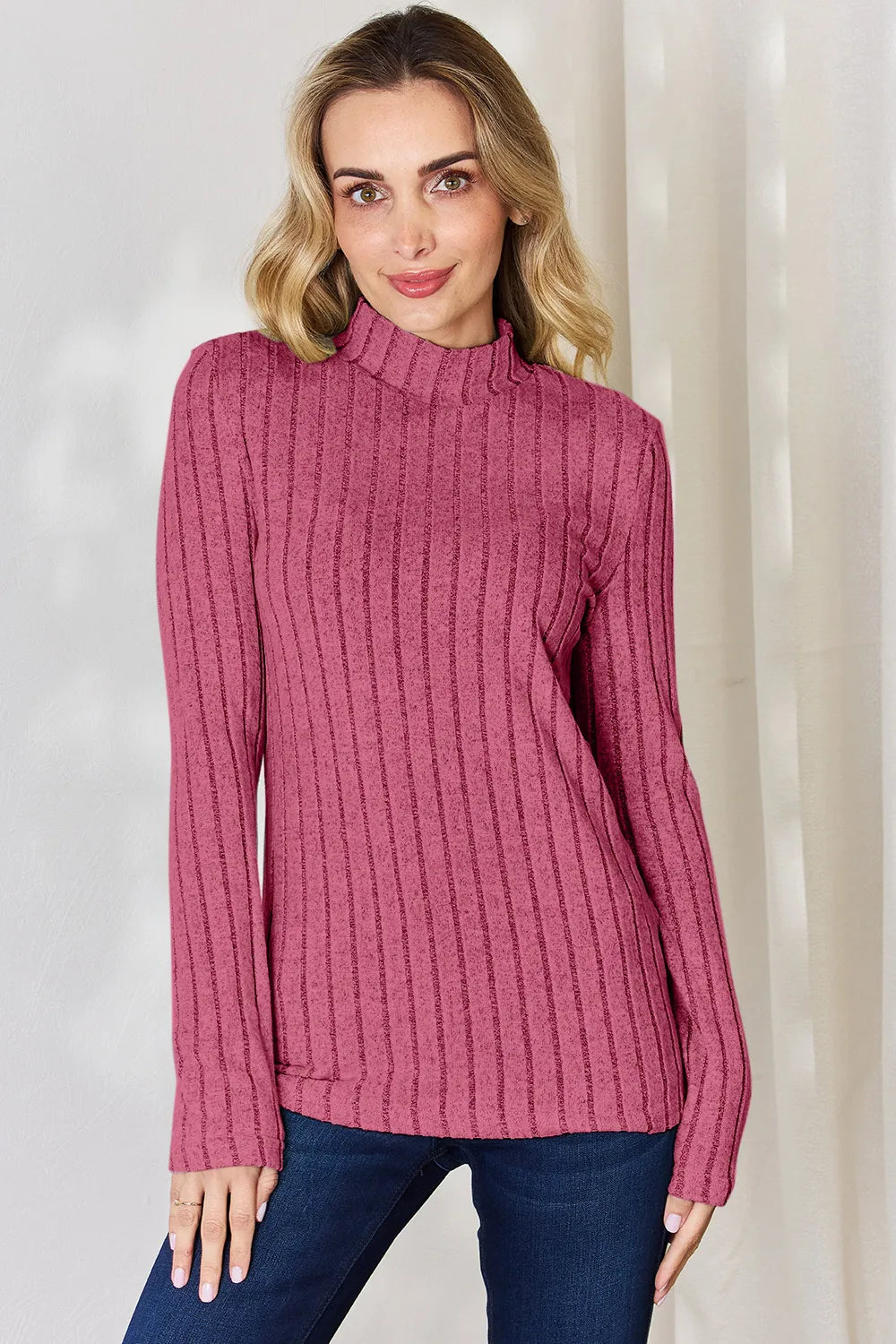Hot Pink ribbed mock-neck long-sleeve top, product view; one top included, jeans and accessories excluded