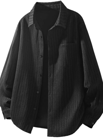 Black textured men’s button-up shacket, front view; dark inner top not included.