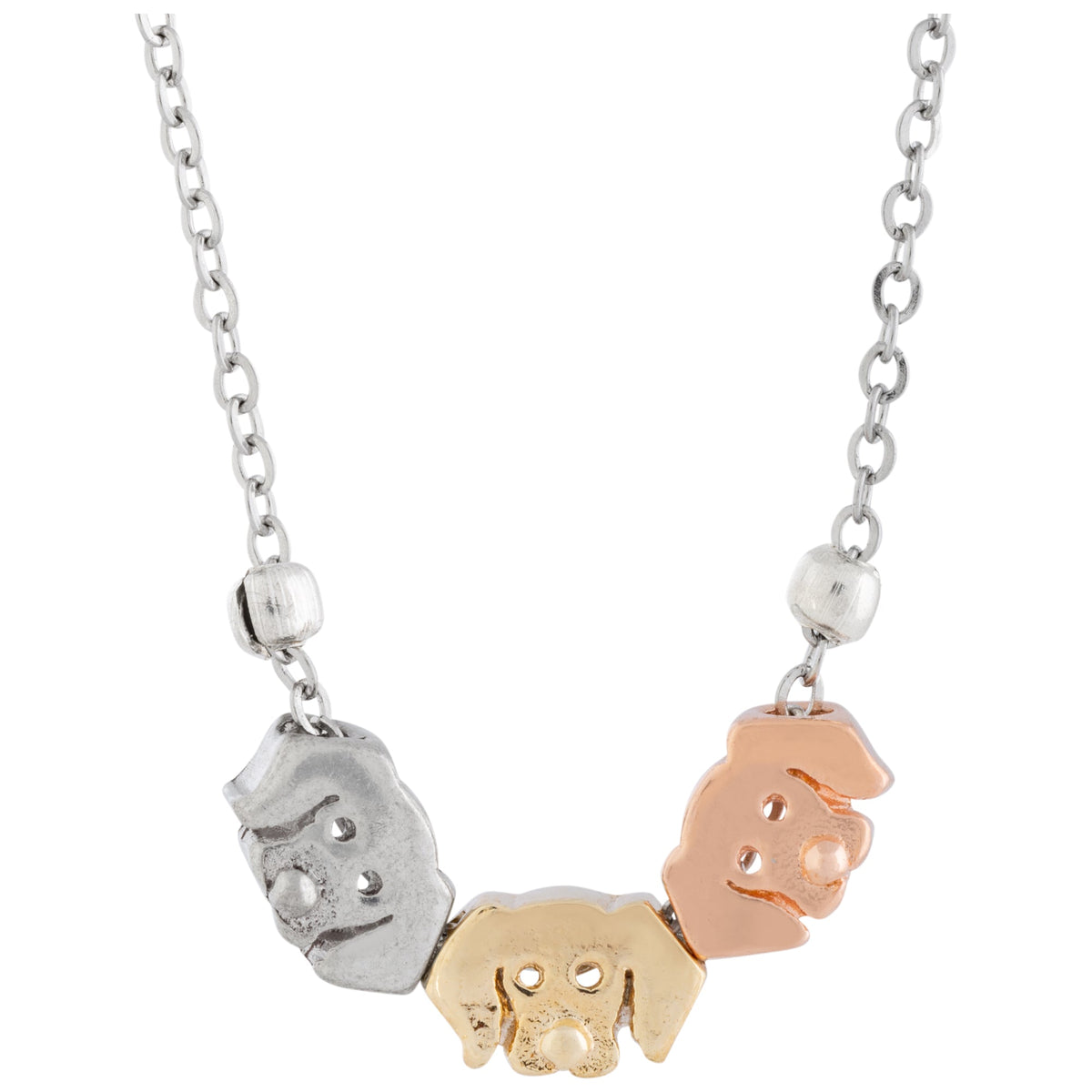 Close-up of three dog-face charms in contrasting metal tones on the bracelet chain.
