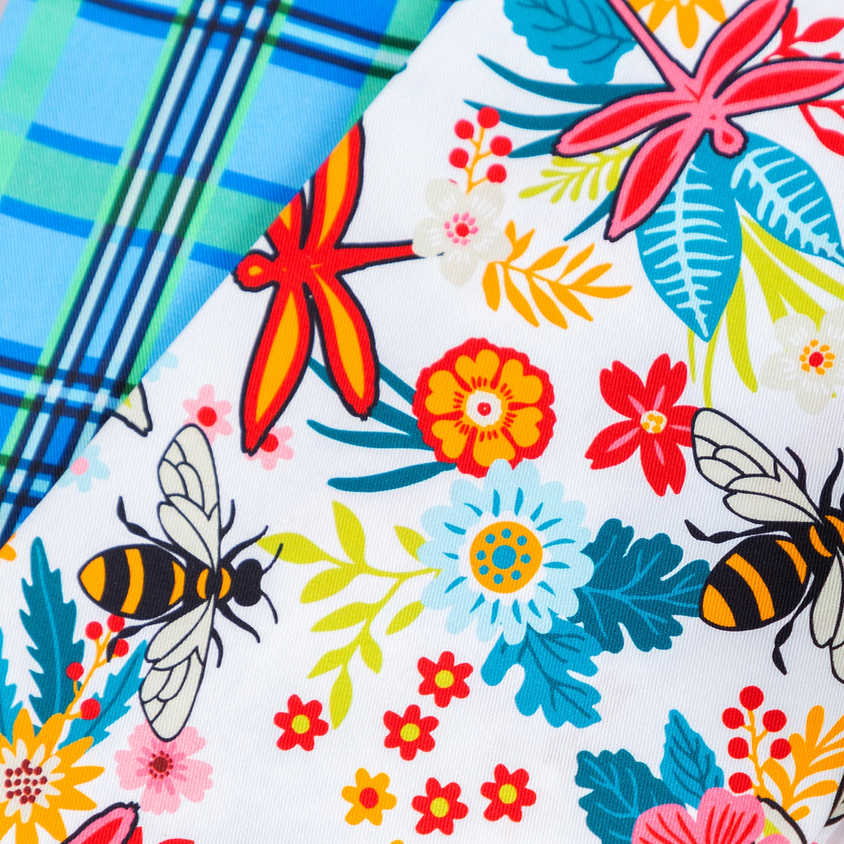 Close-up of the floral Garden of Dragonflies towel print.
