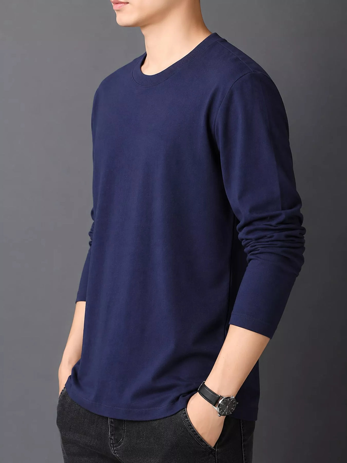Navy men's cotton long-sleeve crewneck tee, side view.