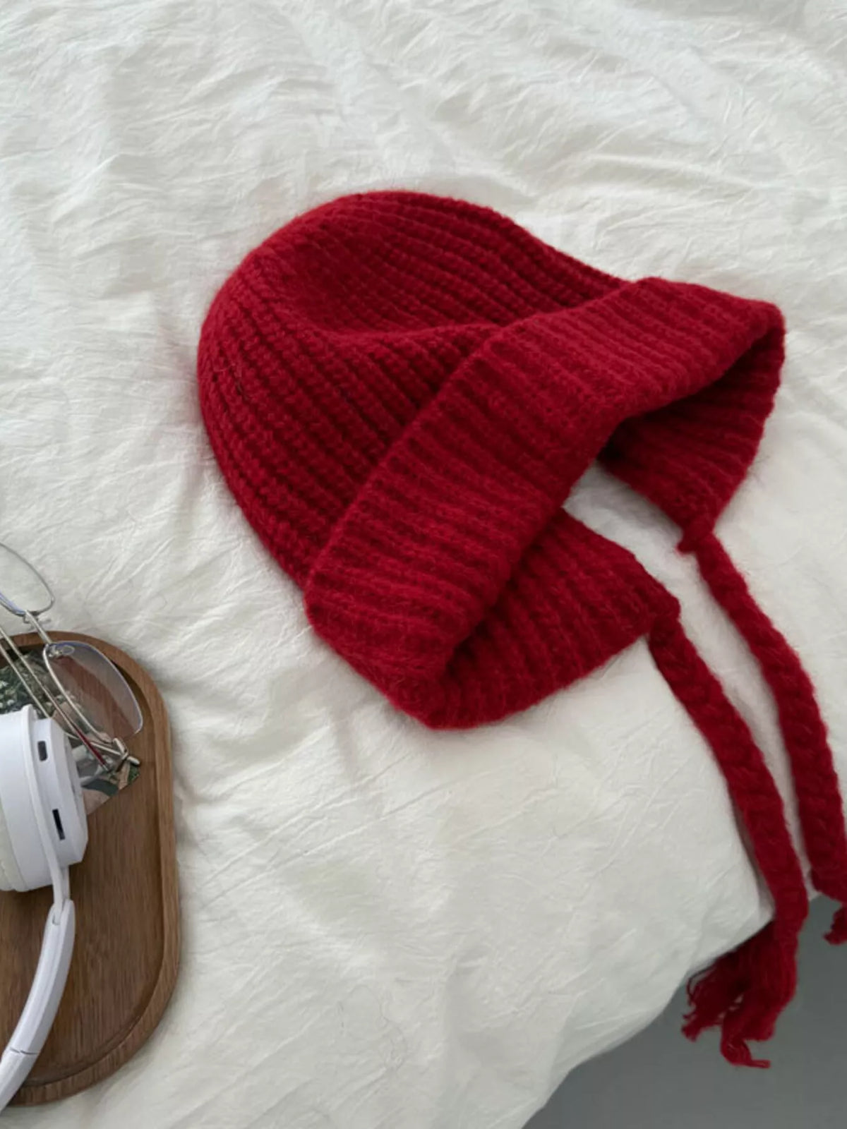 Red ribbed knit beanie with long braided ties