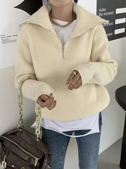 Half-zip long-sleeve ribbed sweater with a high collar.