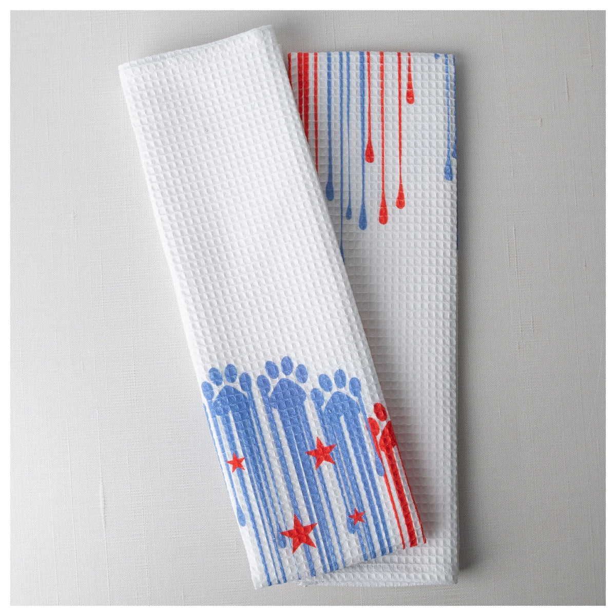 Folded Painted Paws cotton kitchen towel.