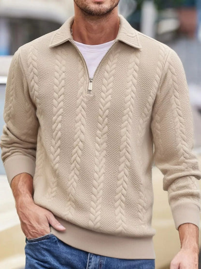 Men's beige cable-textured quarter-zip pullover with pointed collar and ribbed cuffs and hem, shown on a model.