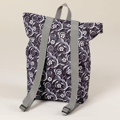Rear view of the Flourish Paws backpack with gray shoulder straps.