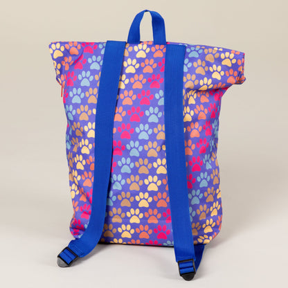 Rear view of the Diagonal Paws backpack with blue shoulder straps.