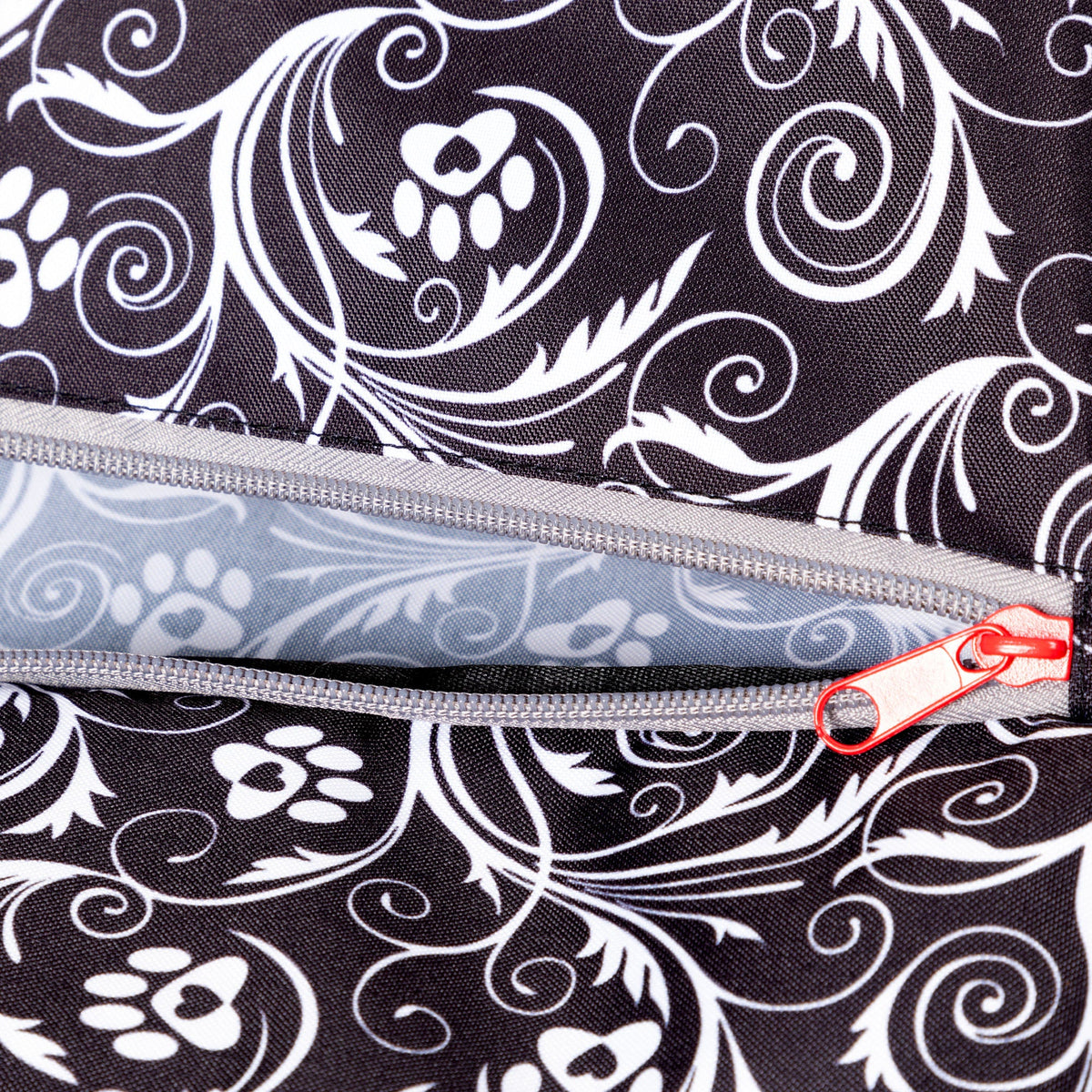 Close view of the Flourish Paws backpack's zippered pocket.