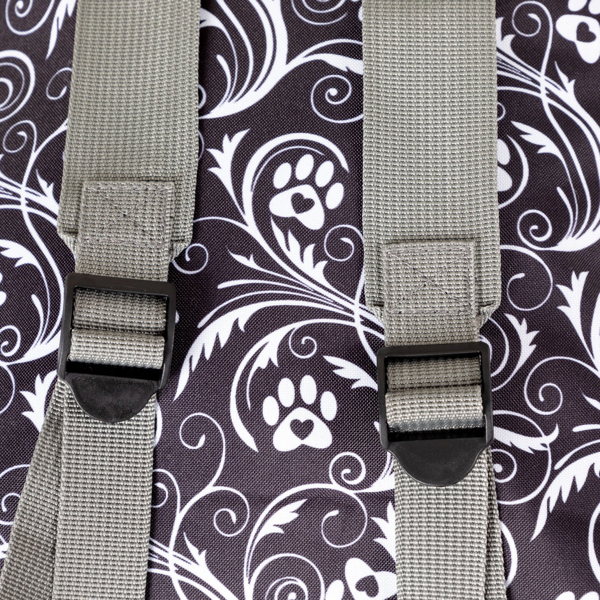 Close view of the Flourish Paws backpack's gray shoulder straps and adjusters.