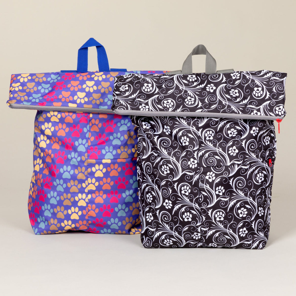 Diagonal Paws and Flourish Paws backpack designs shown together; one selected backpack per order.