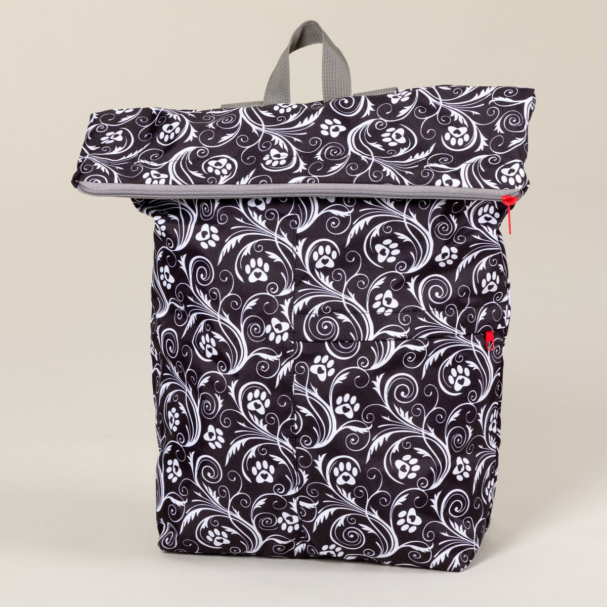 Front view of the Flourish Paws black-and-white packable backpack.