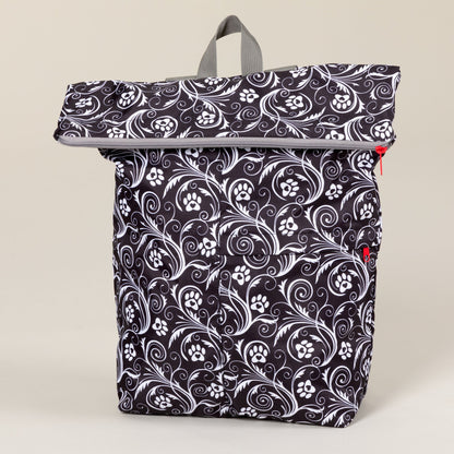 Front view of the Flourish Paws black-and-white packable backpack.