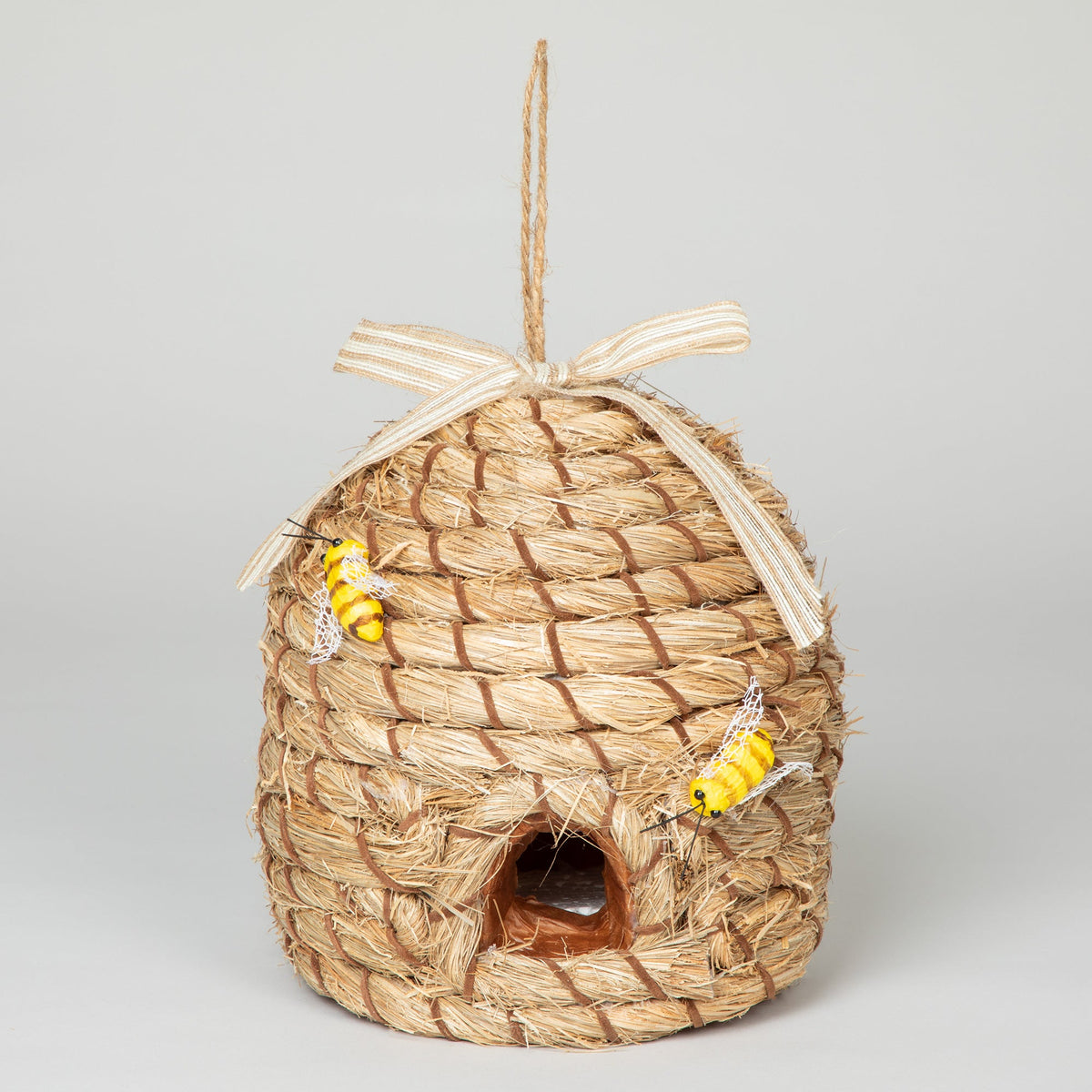 Front view of the decorative beehive-shaped birdhouse with faux bees and hanging loop.
