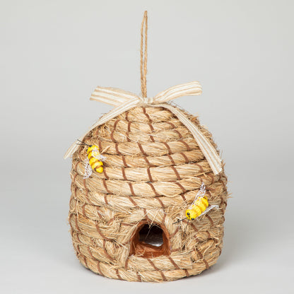 Front view of the decorative beehive-shaped birdhouse with faux bees and hanging loop.