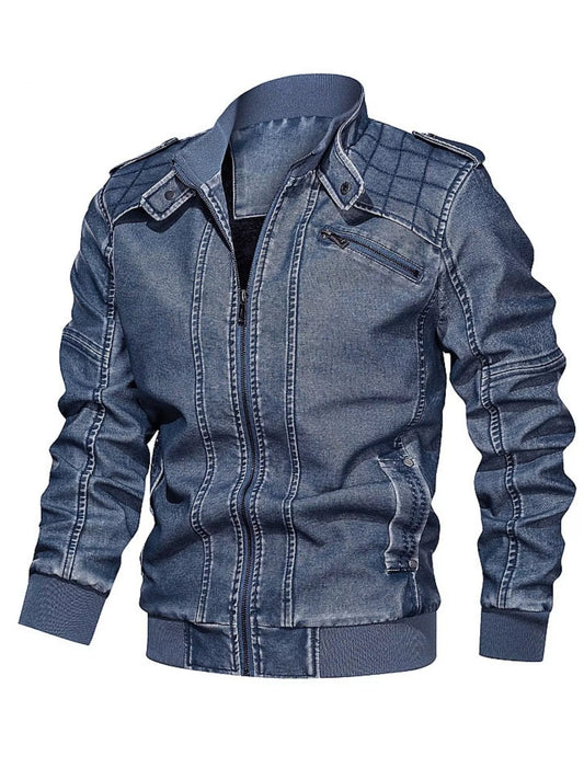 Blue zip-front jacket shown from an angled front view with diamond-stitched shoulder panels and ribbed cuffs.