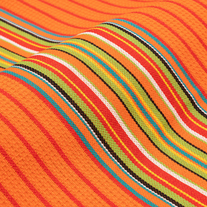 Close view of an orange Salsa Stripe cotton towel