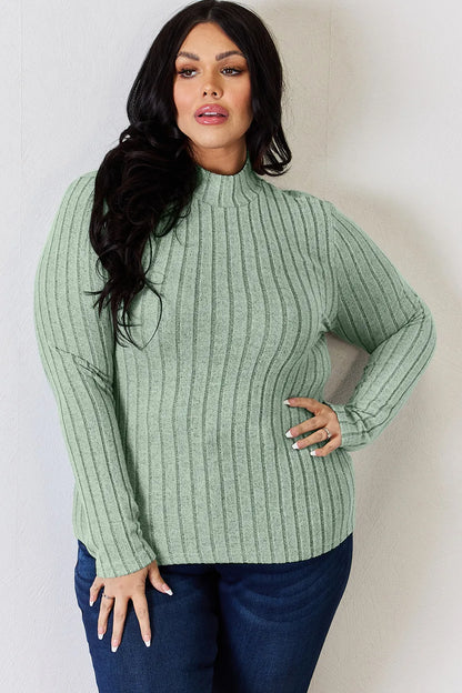 Light Green ribbed mock-neck long-sleeve top, product view; one top included, jeans and accessories excluded