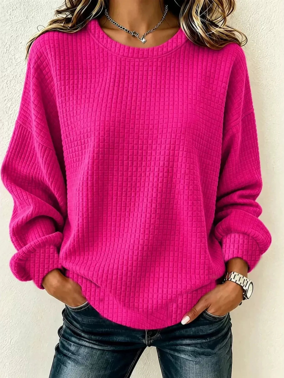 Front view of a Fuchsia Pink long-sleeve crew-neck waffle-knit sweatshirt. One top only.