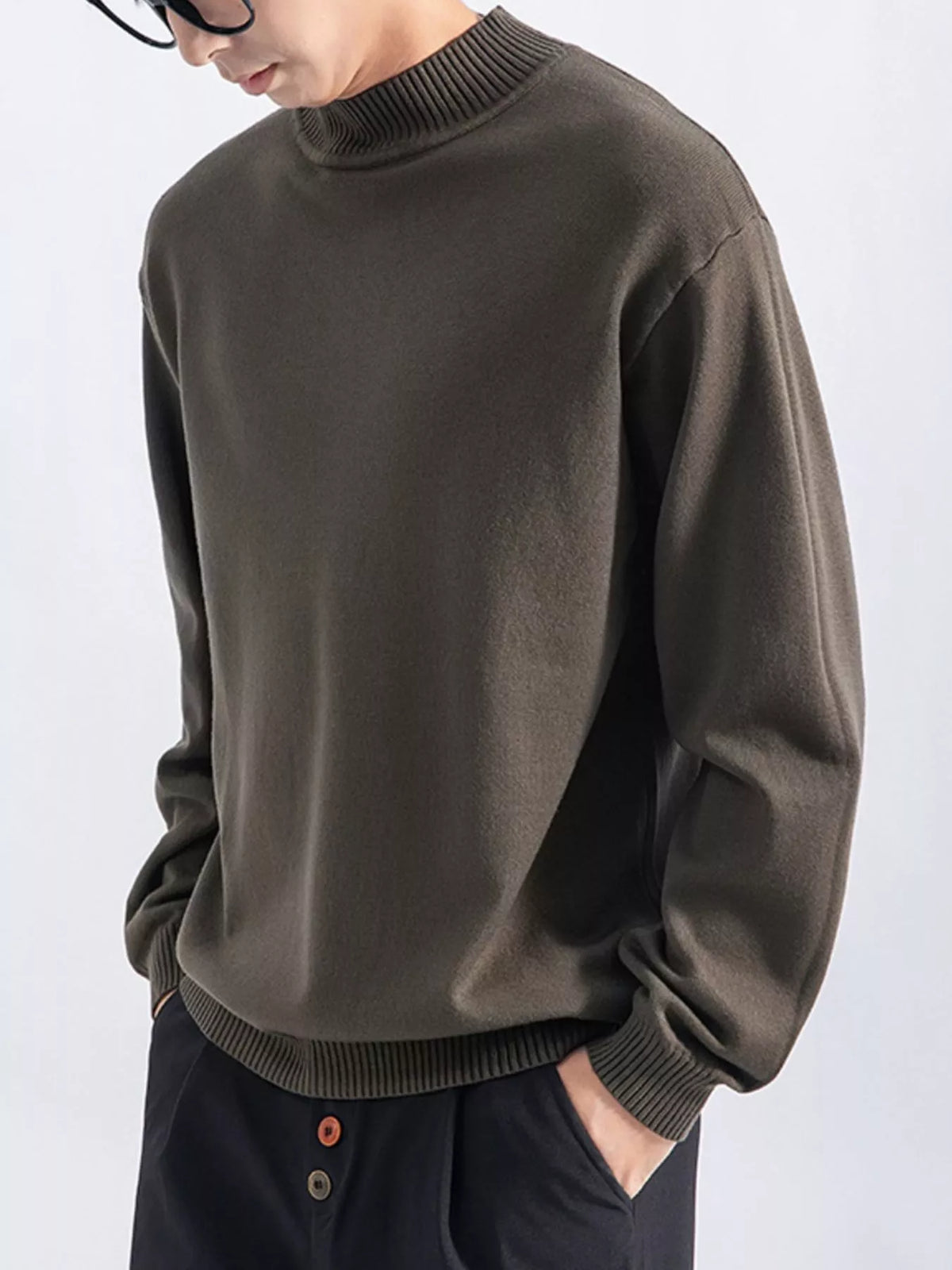 Men's Army Green minimalist mock-neck sweater, alternate front view. Trousers are styling items and are not included.