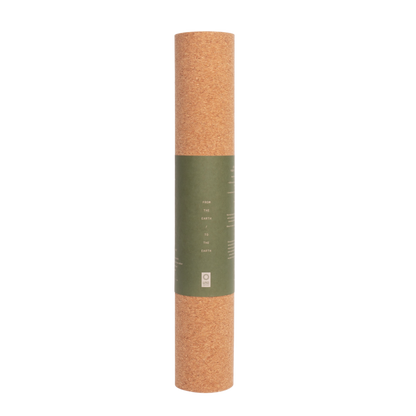 Ananday cork yoga mat rolled upright in its paper sleeve. One 72 by 24 inch mat; accessories not included.