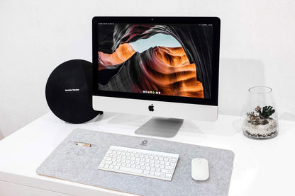 Gray Bagby MAT desk pad with keyboard and mouse in a home office setting