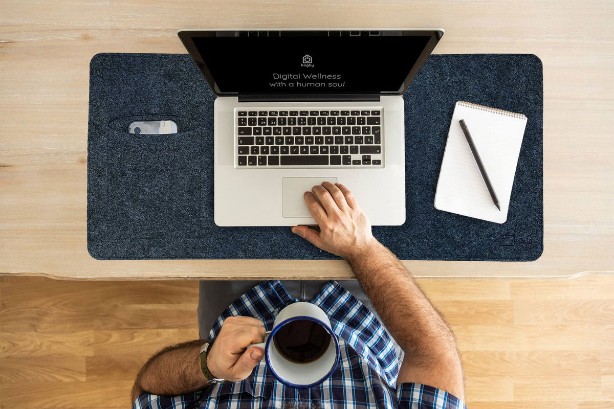 Charcoal Bagby MAT desk pad in use with a laptop, seen from above