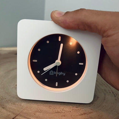 White Bagby MINIMALIST clock with night light illuminated