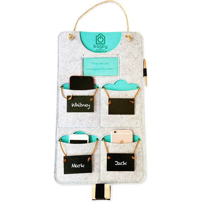 Light gray and teal four-pocket felt phone organizer with cord hanger and chalkboard name tags.