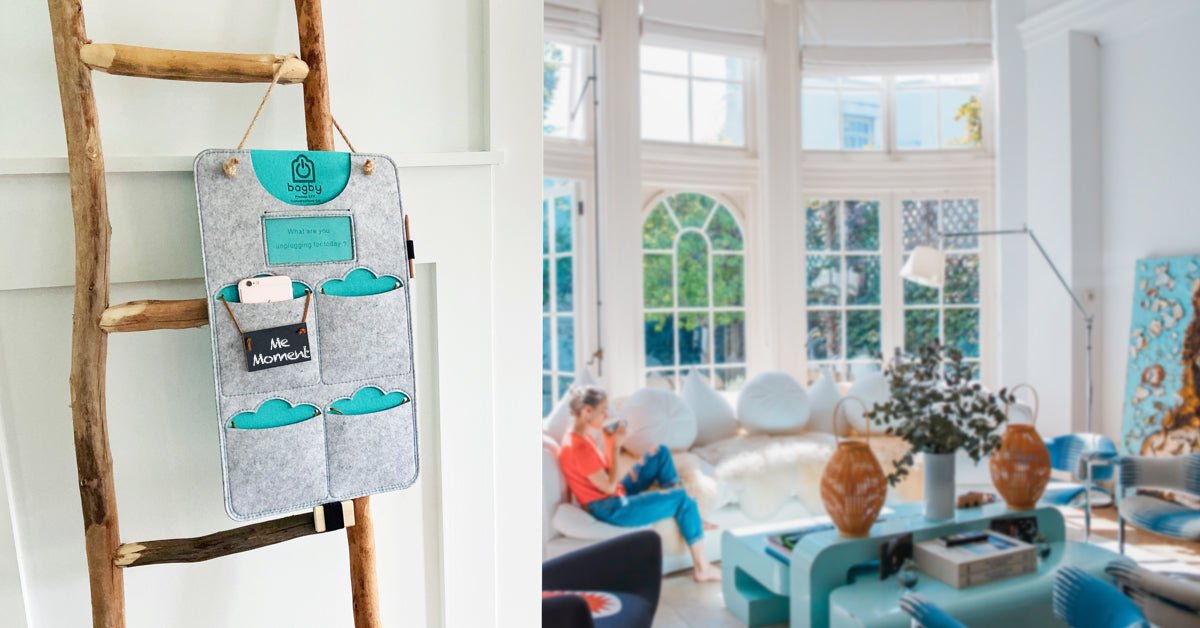Kitchen scene with a charcoal four-pocket phone organizer hanging near people preparing food.