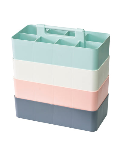 Four stacked Enjoy Organizer caddies in mint, ivory, pink and gray.