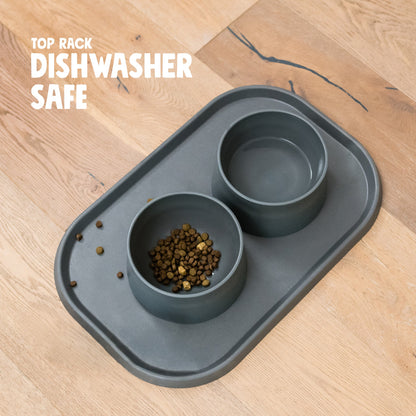 Sea Fog West Paw placemat shown with bowls and kibble, with top-rack dishwasher-safe care information