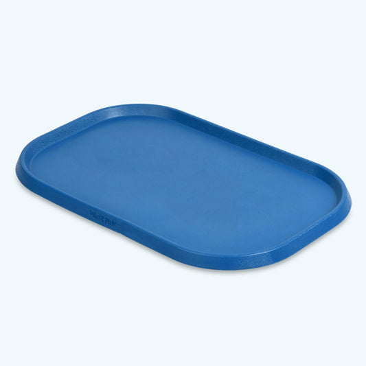 Marine blue West Paw feeding placemat with raised rim, shown alone