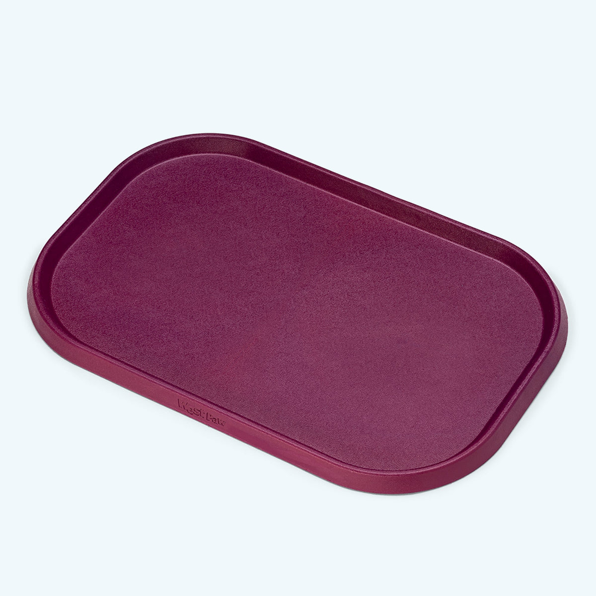 Tropic Red West Paw feeding placemat with raised rim, shown alone