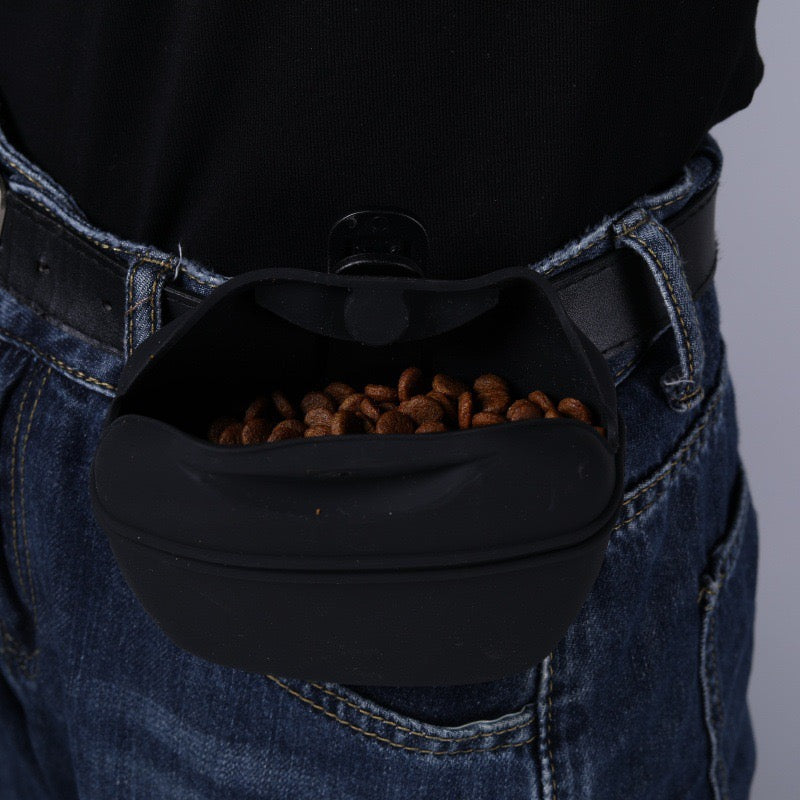 Black demonstration pouch clipped at the waist; treats not included