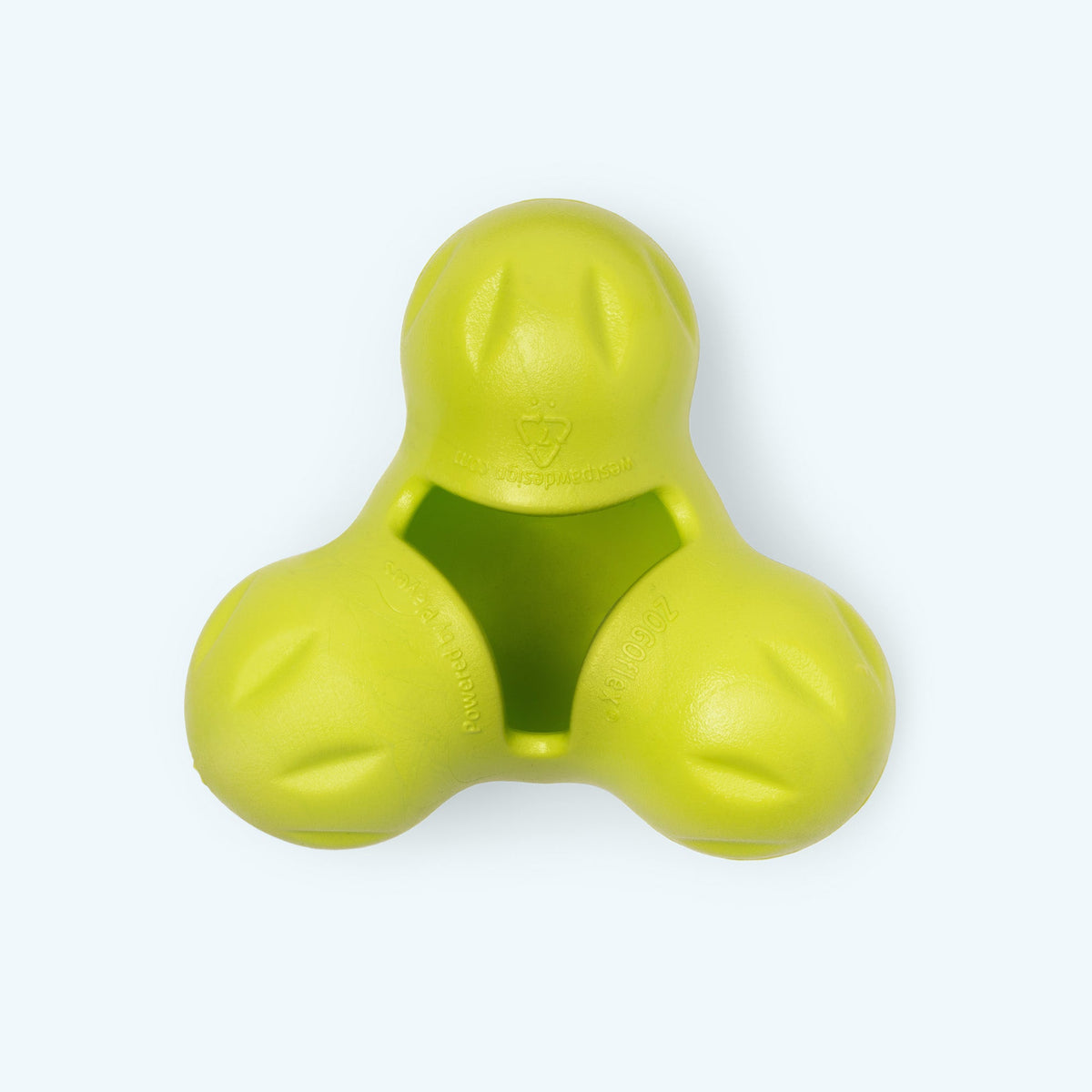 Granny Smith green West Paw Tux treat toy shown from the front, with its central cavity visible.