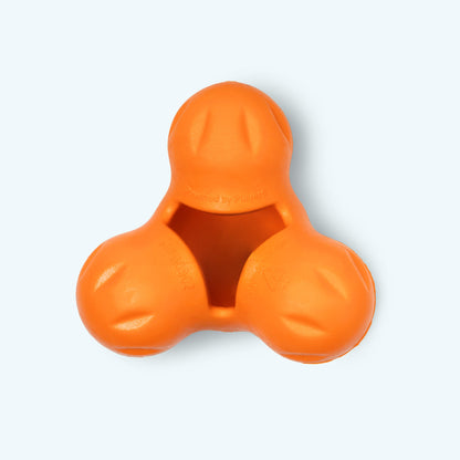 Tangerine West Paw Tux treat toy, with three rounded lobes and its central treat cavity visible.