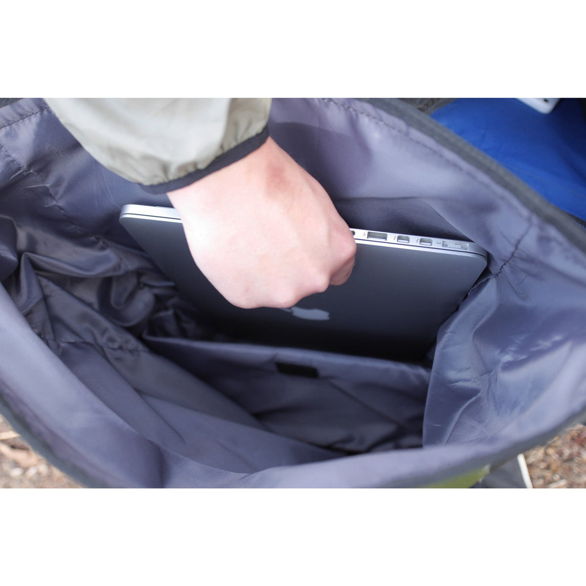 Laptop-compartment demonstration; laptop not included.