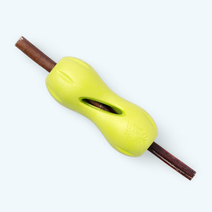 A bully stick passes through a Granny Smith West Paw Qwizl toy; bully stick is not included.